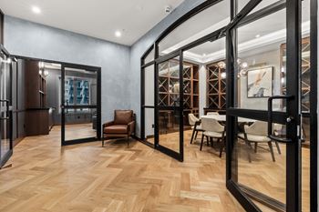 A room with wooden floors and a glass door.